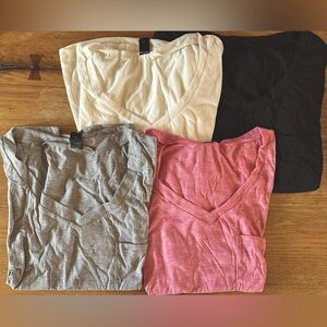 Women’s light weight tee shirts 4 pack all Large. Colors white,pink,gray,black